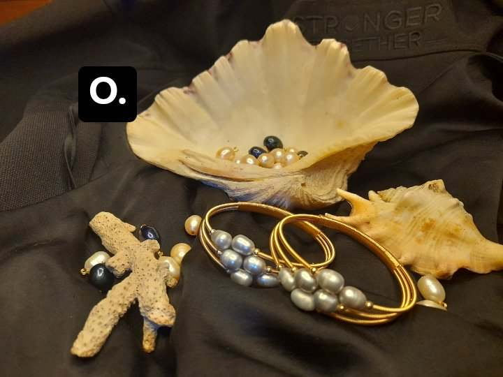  Adjustable bangle bracelet with sea water gray pearls in a fashionable  golden color unique style bracelet.